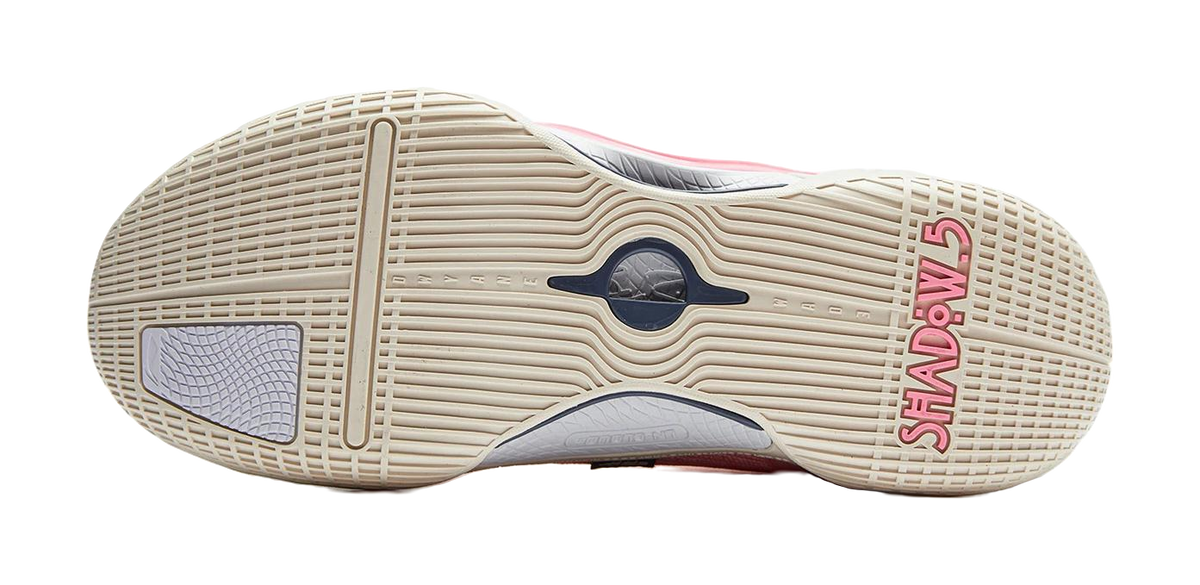 Basketball shoe outsole with beige traction tread and dark blue logo detail