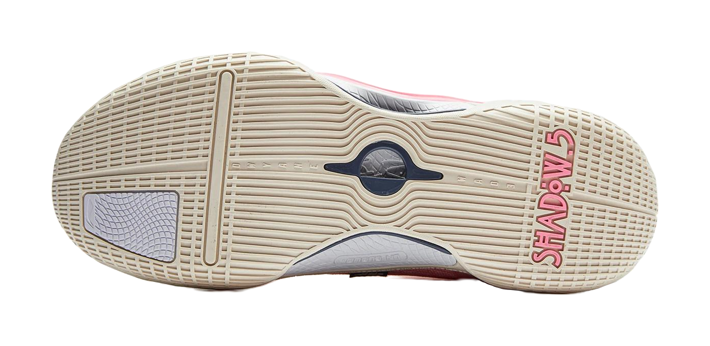 Basketball shoe outsole with beige traction tread and dark blue logo detail