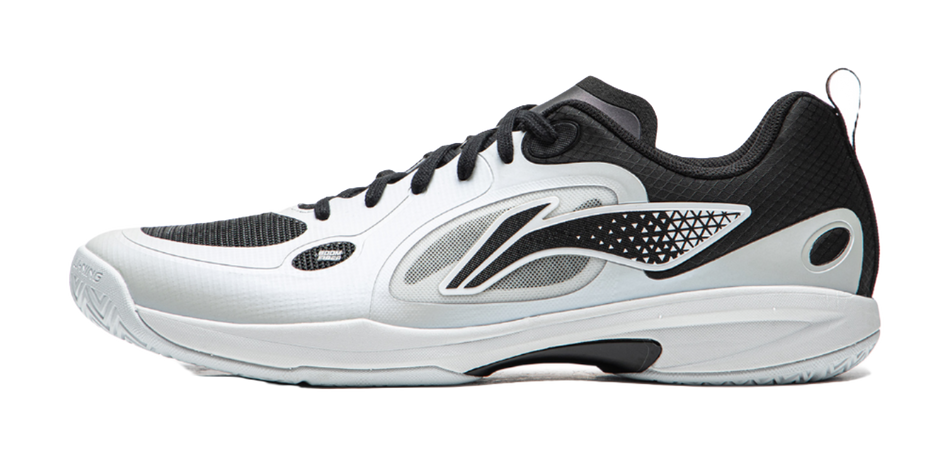 Table tennis shoe with white upper, black lace-up, and side logo accents