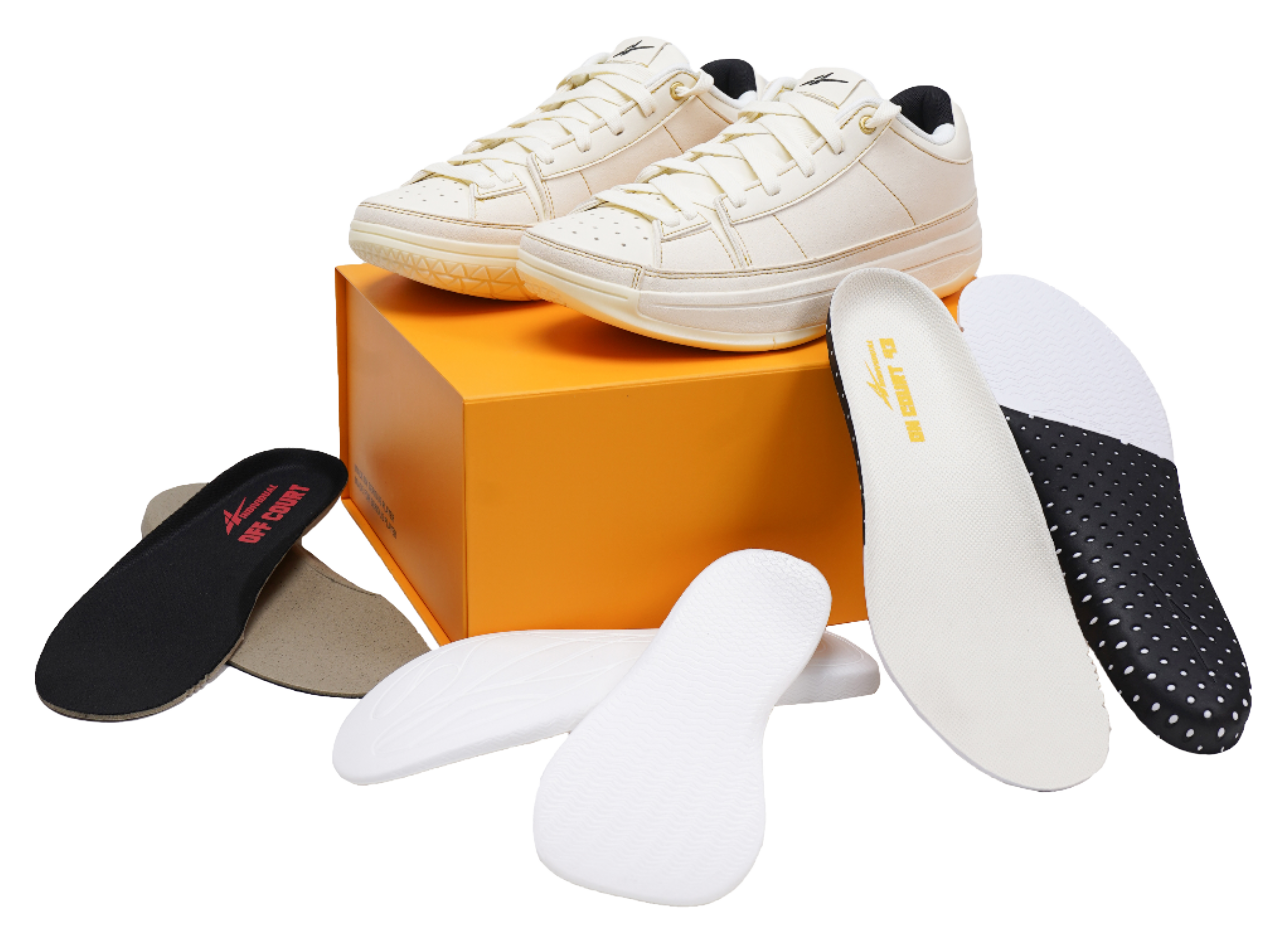 Cream basketball shoes with extra insoles and orange shoebox