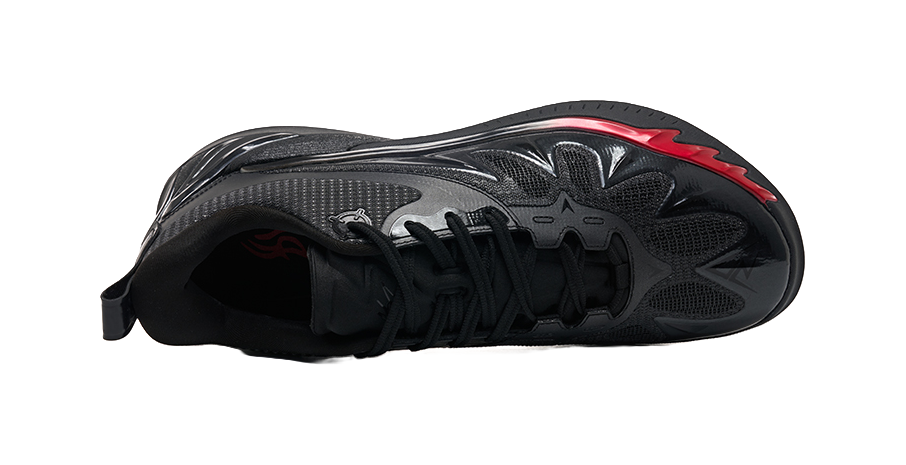 Unisex low-top basketball shoe with black upper and red accent on the outsole