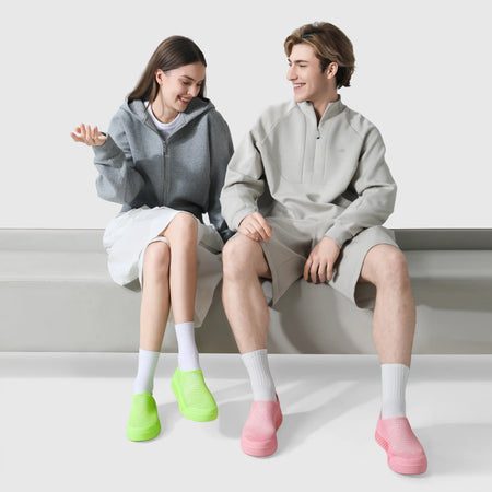 Neon green and pink 3D-printed casual sneakers worn with crew socks