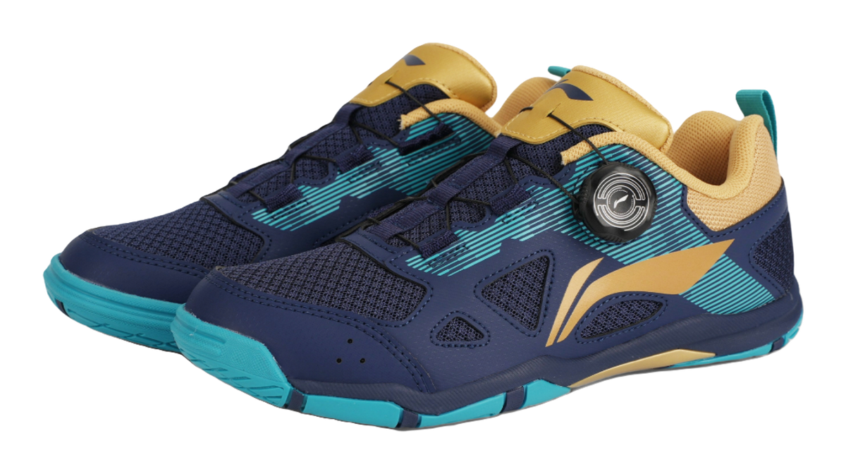 Pair of table tennis shoes in dark blue with gold panels and teal striped accents