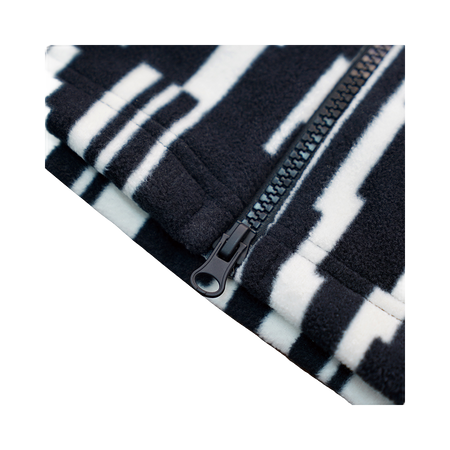 Zip sweatshirt jacket fabric close-up with black-and-white all-over pattern and zipper pull.