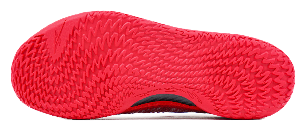 Red basketball shoe outsole with zigzag tread pattern