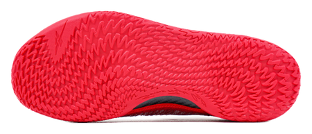 Red basketball shoe outsole with zigzag tread pattern