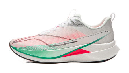 Running shoe with white base and pink patterned upper, green stripe trim, red accent on midsole
