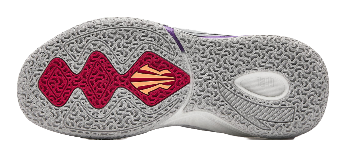 Purple and red basketball shoe outsole with textured gray tread pattern.