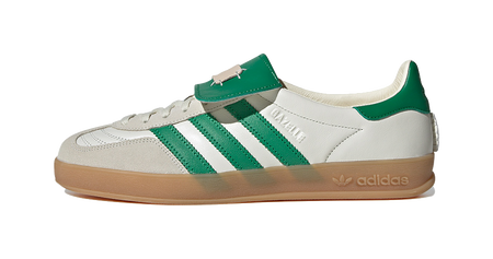 Low-top Gazelle skate shoes with white upper, green stripes, lace-up, gum sole
