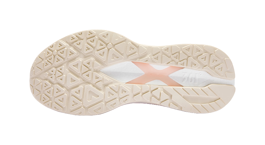 Low-top running shoe outsole tread in pink and white with grippy geometric pattern