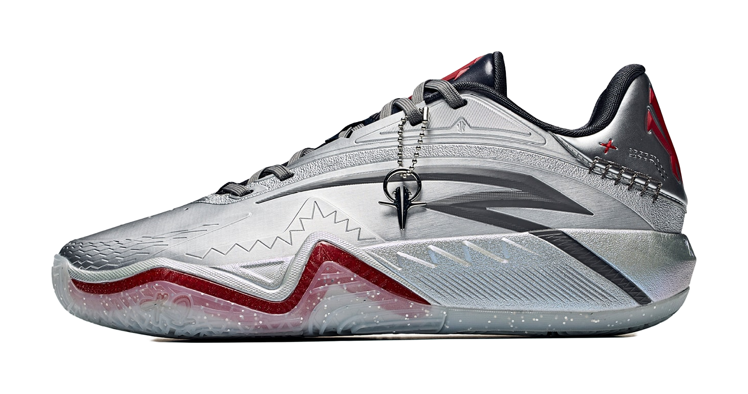 Low basketball shoe in silver-gray with black collar and crimson/red accents, lace-up