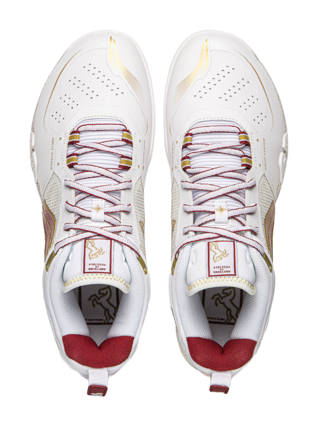 Pair of white badminton shoes with red laces, perforations, and padded tongue