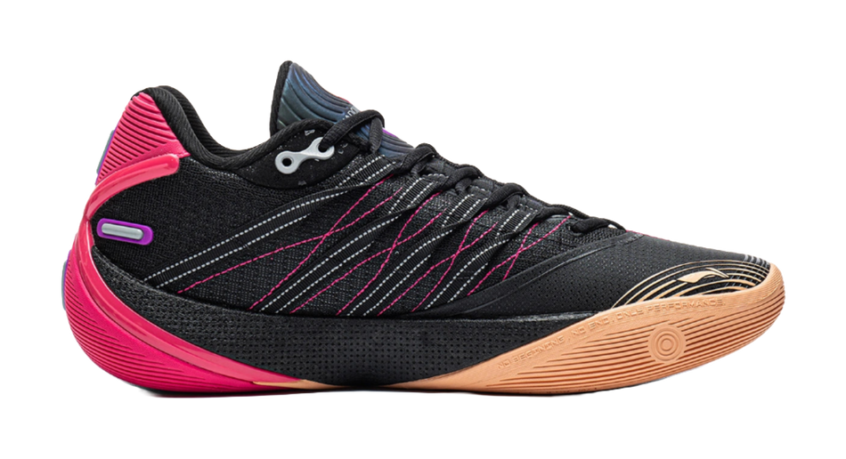 Low basketball shoe angled view: black upper with pink heel, purple logo, gum sole.