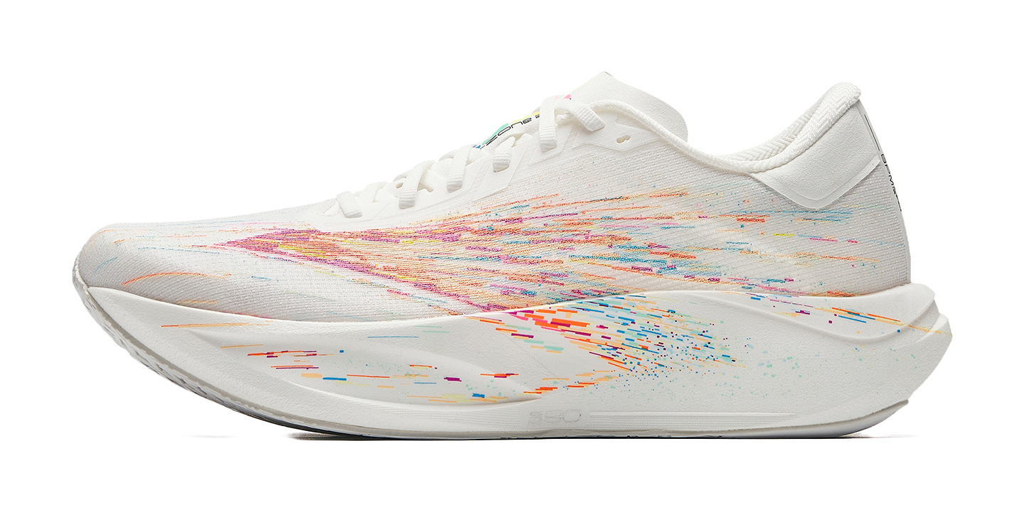 White running shoe with multicolor speckled upper and lace-up design