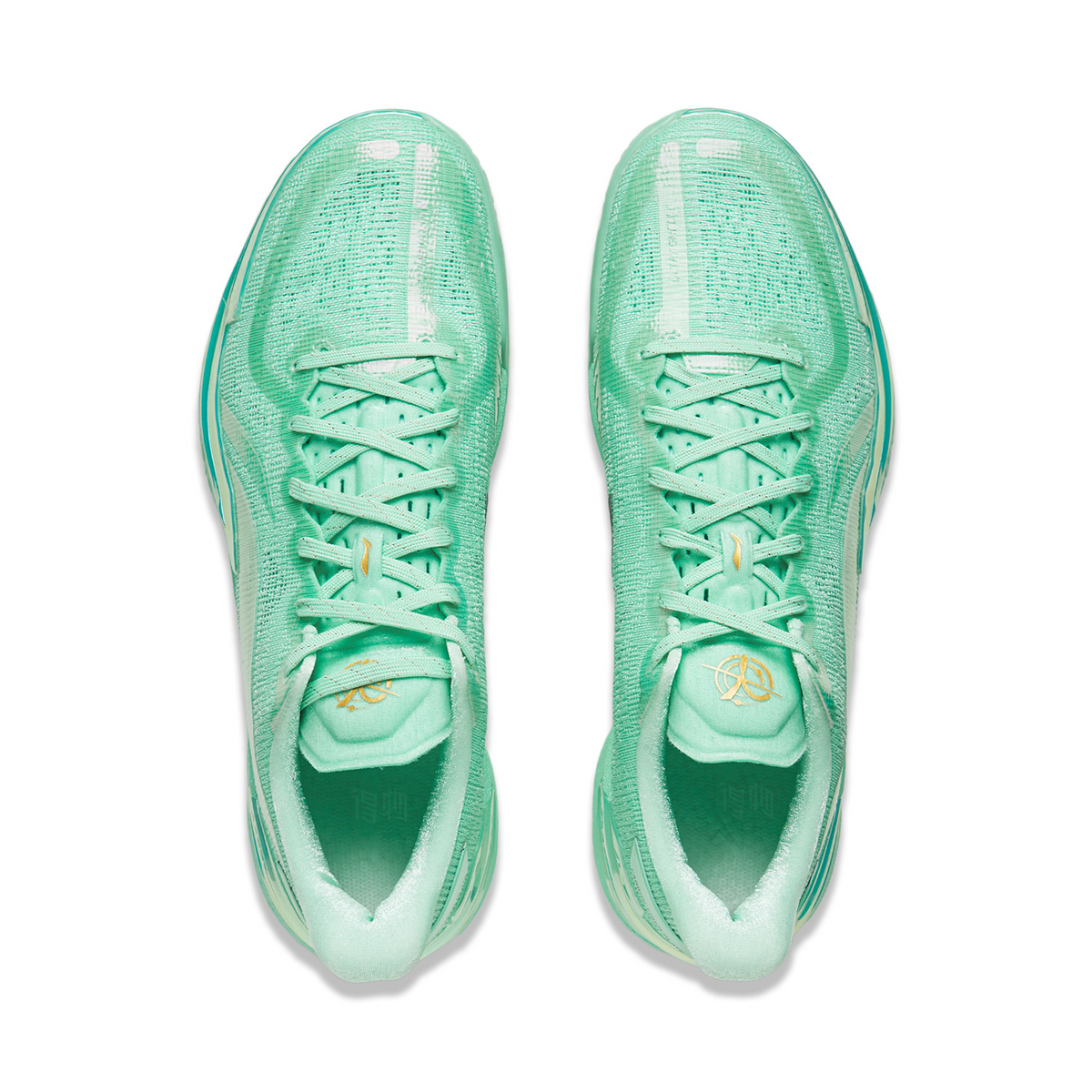 Pair of mint-green shoes showing lace-up tongues and light translucent heel guards.