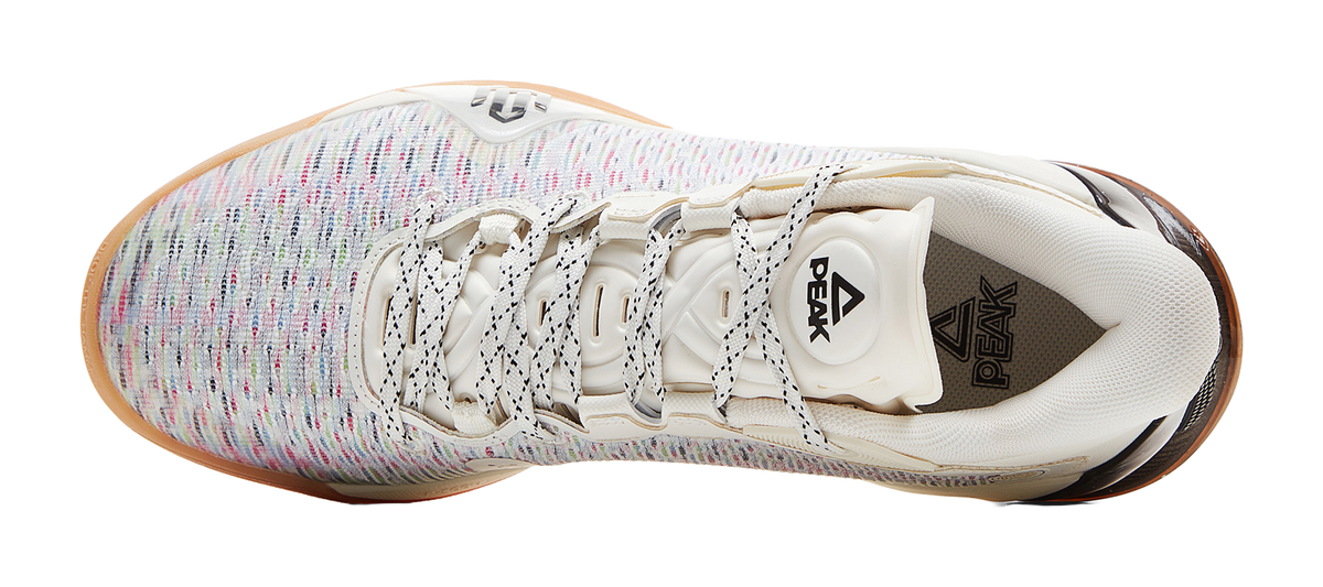Ivory basketball shoe with lace-up knit upper and black logo on heel