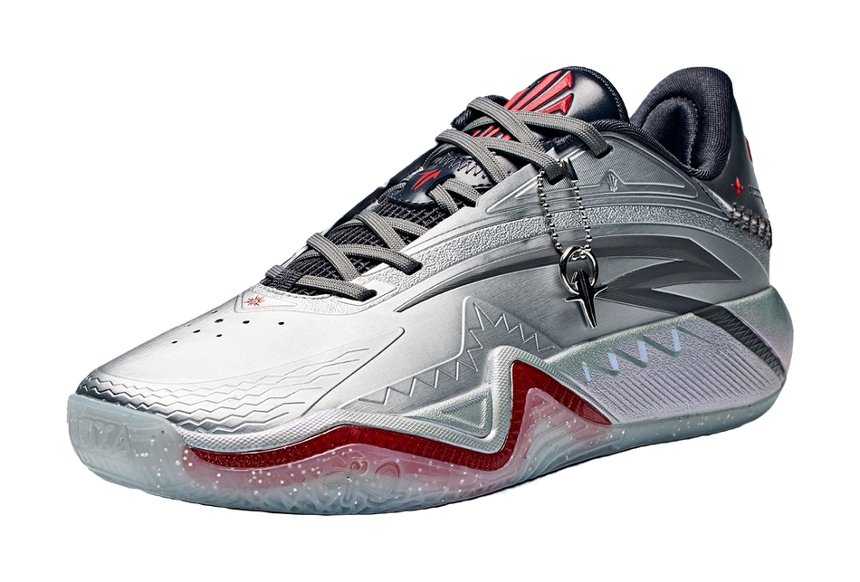 Low basketball shoe, silver-gray upper with black laces, gray strap and red trim