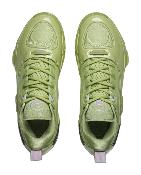 Pair of green basketball shoes front view with lace rows and cushioned tongue