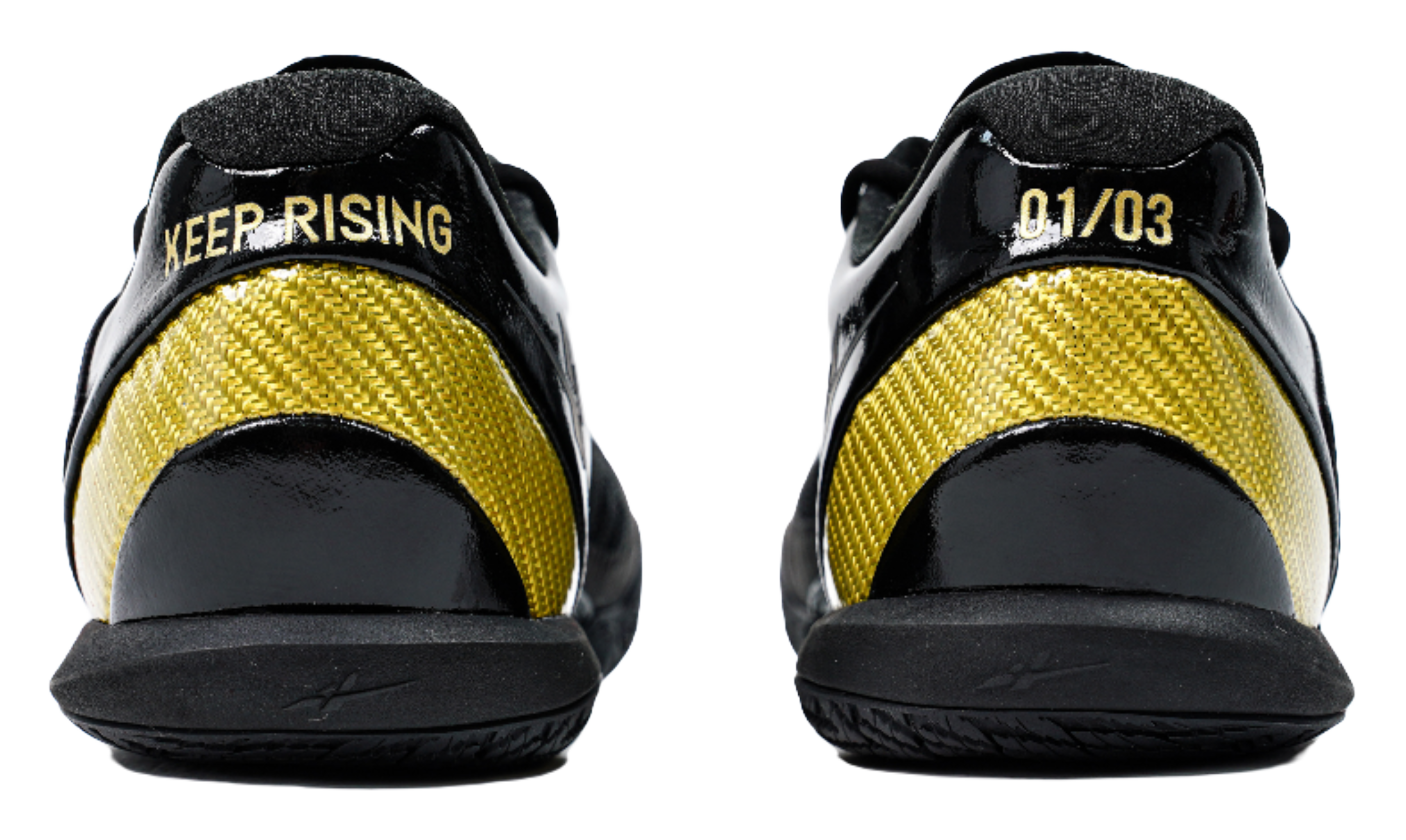 Black low-cut basketball shoes with yellow mesh panels and heel text detail