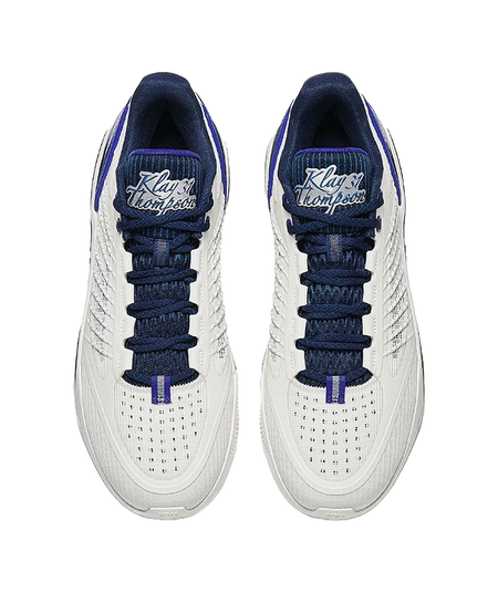 Pair of unisex low basketball shoes with navy laces and white mesh quarter