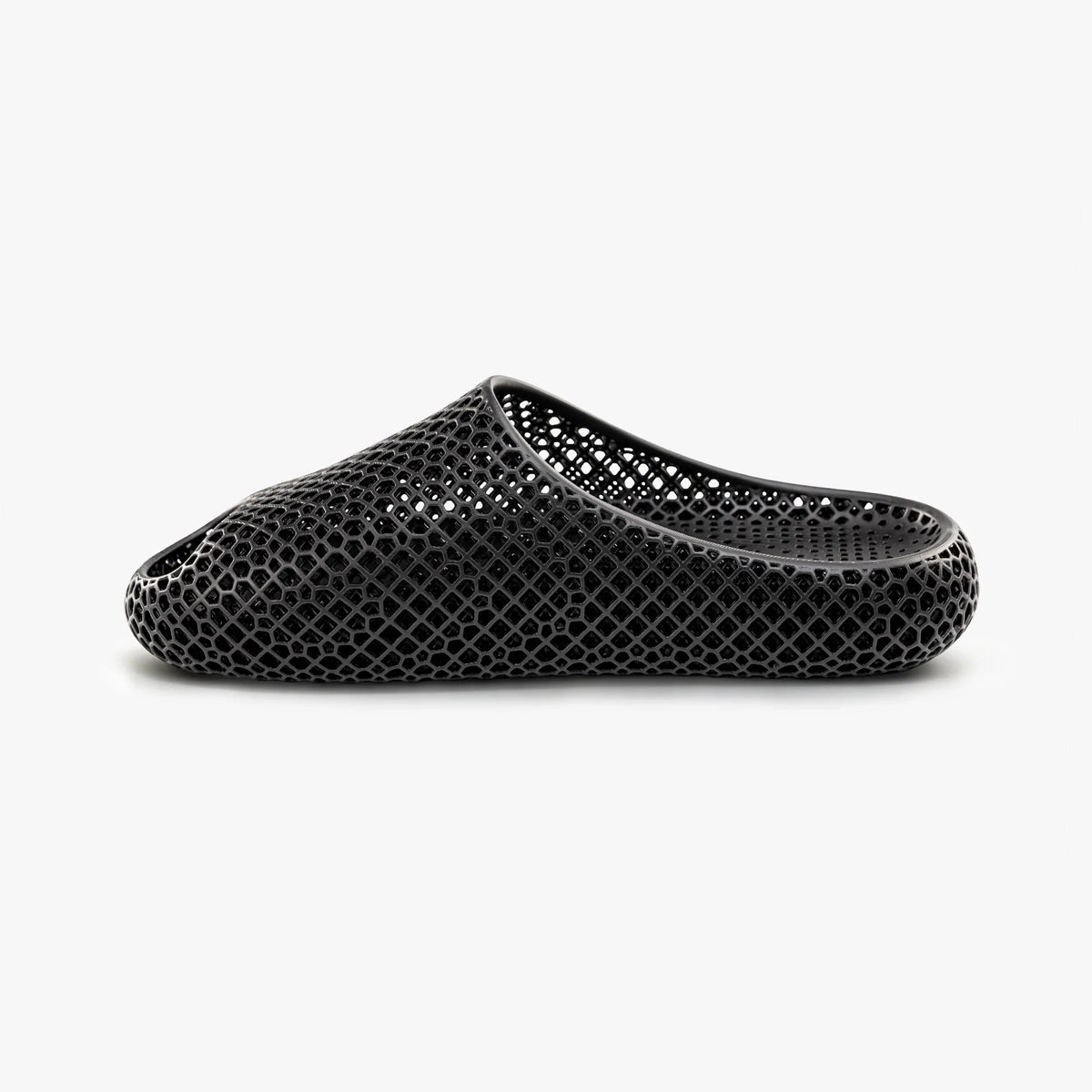 Black 3D-printed slip-on slippers with textured honeycomb upper and curved side opening