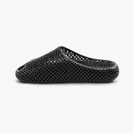 Black 3D-printed slip-on slippers with textured honeycomb upper and curved side opening