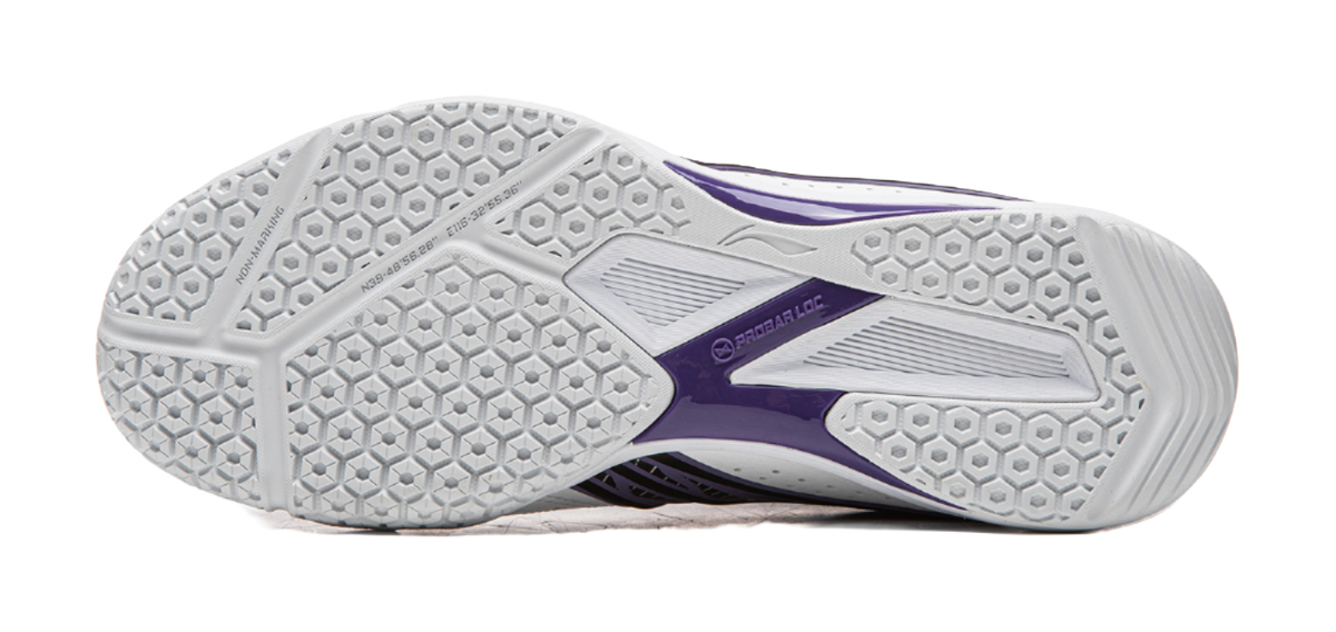 White rubber outsole with hexagon tread and purple heel panel