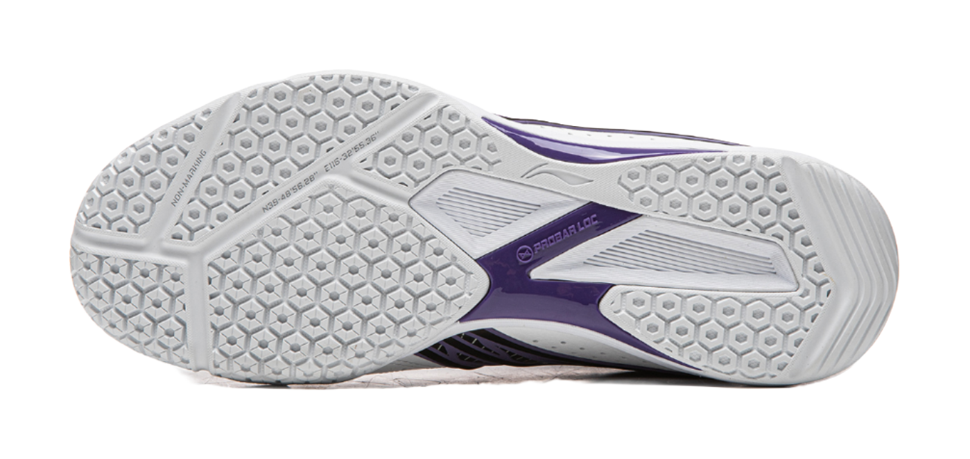 White rubber outsole with hexagon tread and purple heel panel
