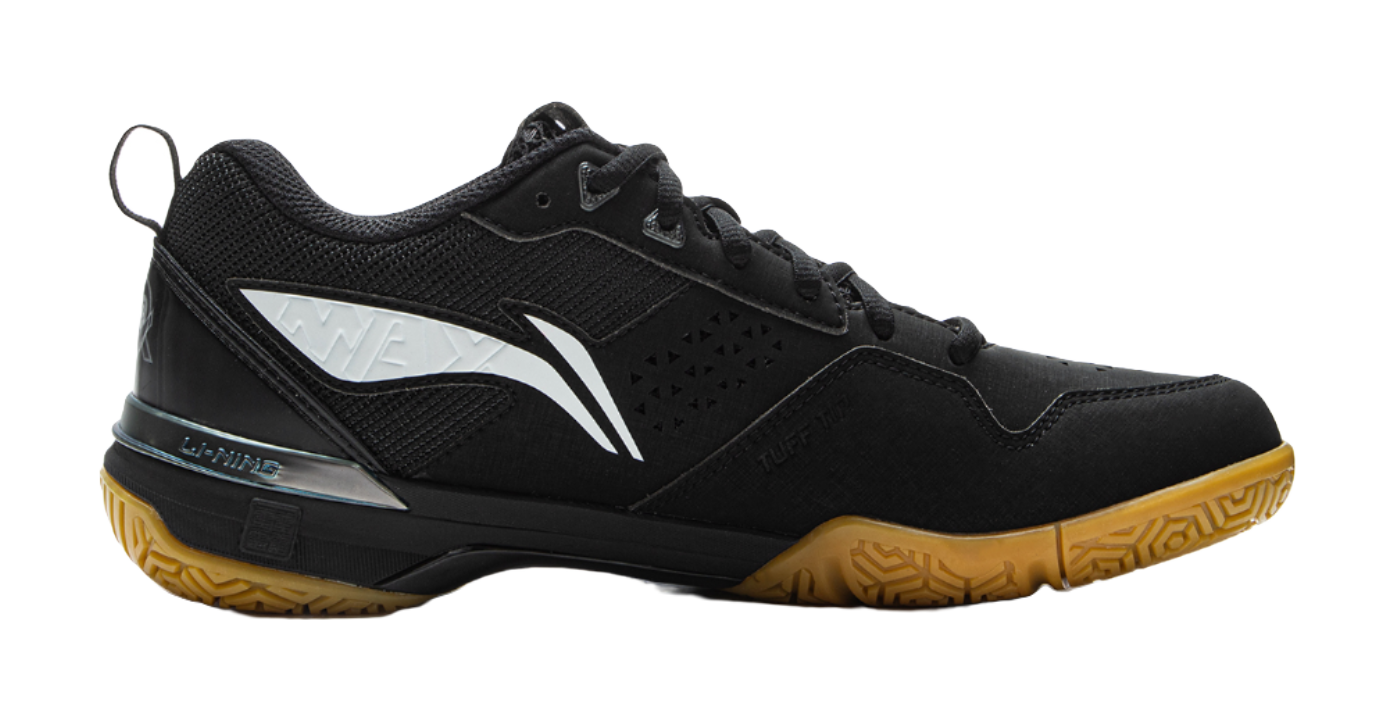 Black badminton shoe side view with white W-shaped stripe and patterned quarter panel.