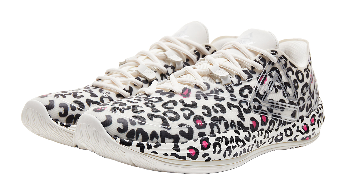 Lightweight basketball shoe, white upper with black leopard print and pink details, front view
