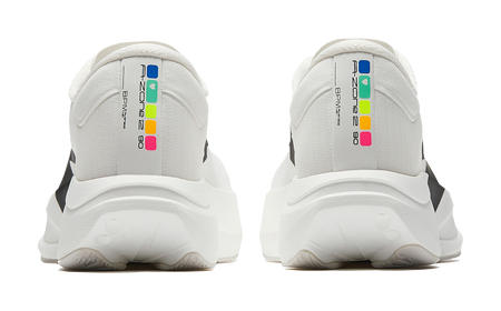 Pair of white running shoes with back heel tabs and colorful logo labels.