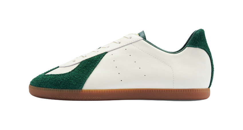 Low-top training shoes with white leather upper and green side panel, gum sole