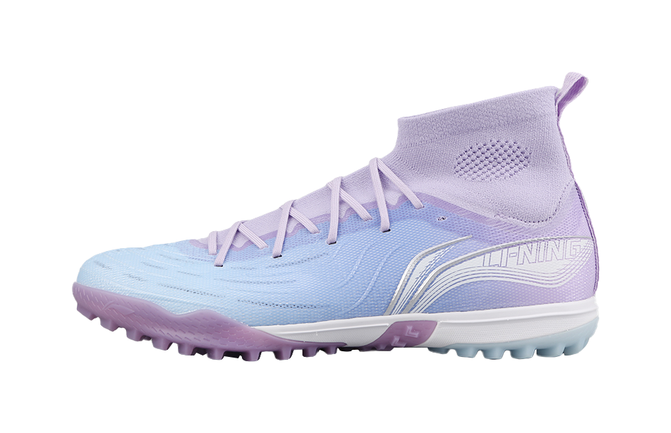 Blue-purple turf soccer shoe with white laces and molded rubber sole