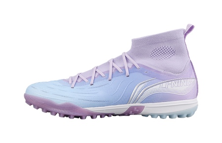 Blue-purple turf soccer shoe with white laces and molded rubber sole