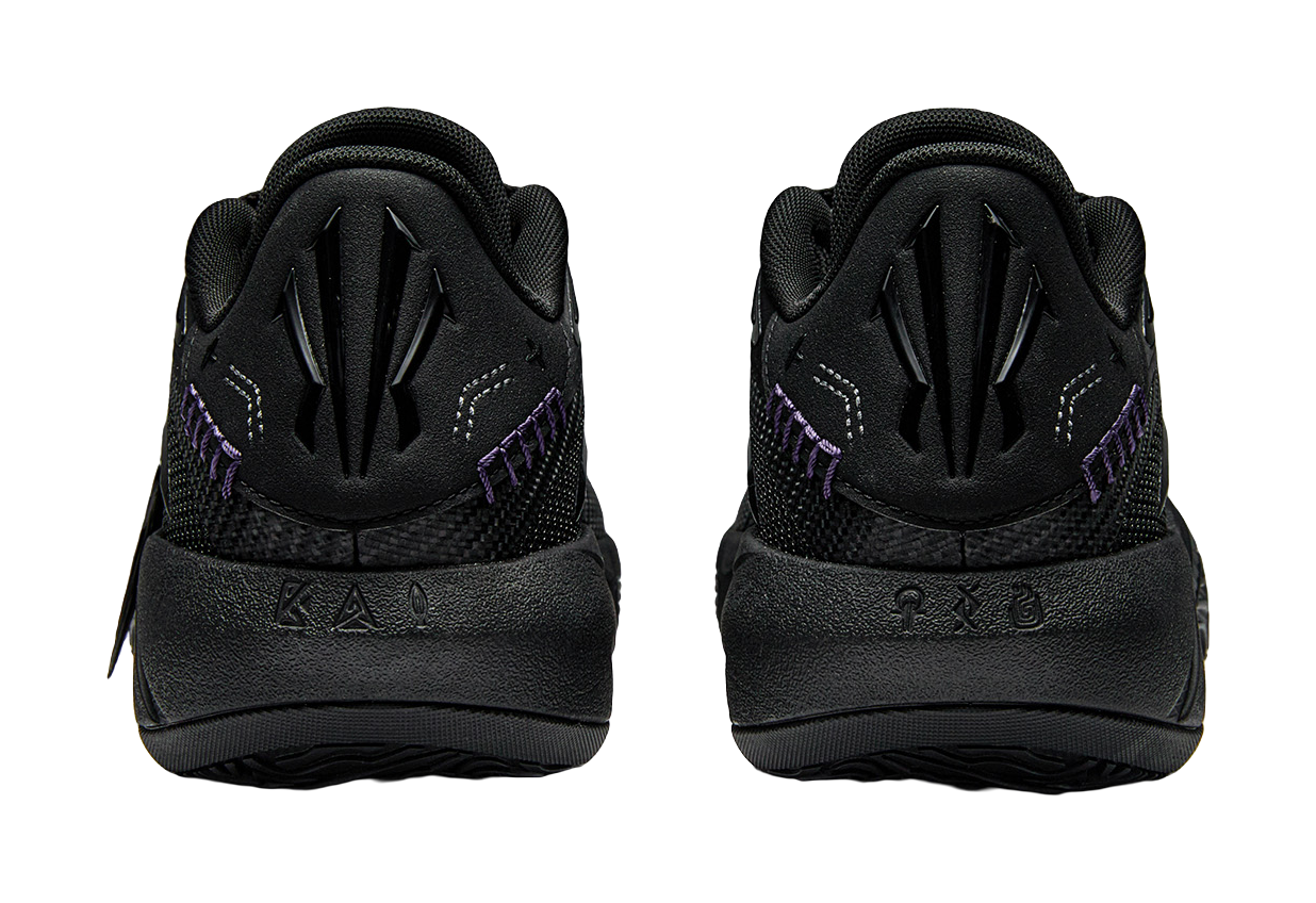 Pair of black basketball shoes with padded heel, lace-up front, purple side detail