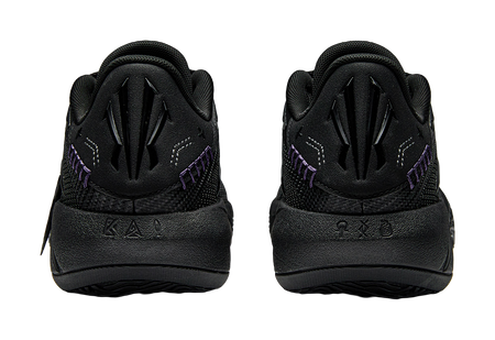 Pair of black basketball shoes with padded heel, lace-up front, purple side detail