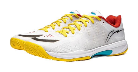 White table tennis shoe with yellow laces and yellow outsole, black logo and red collar