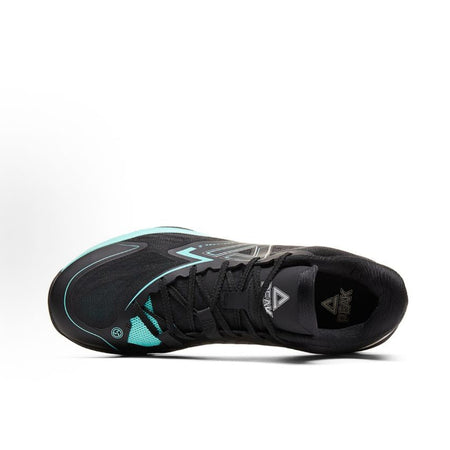 Black basketball shoe with teal piping, lace-up upper, and side branding details