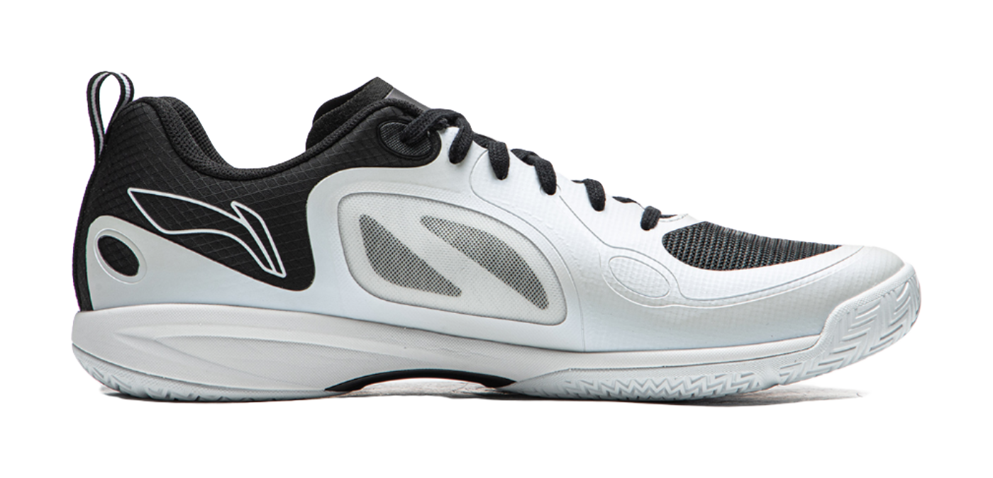 Table tennis shoe in white with black panels, lace-up front, and curved sole