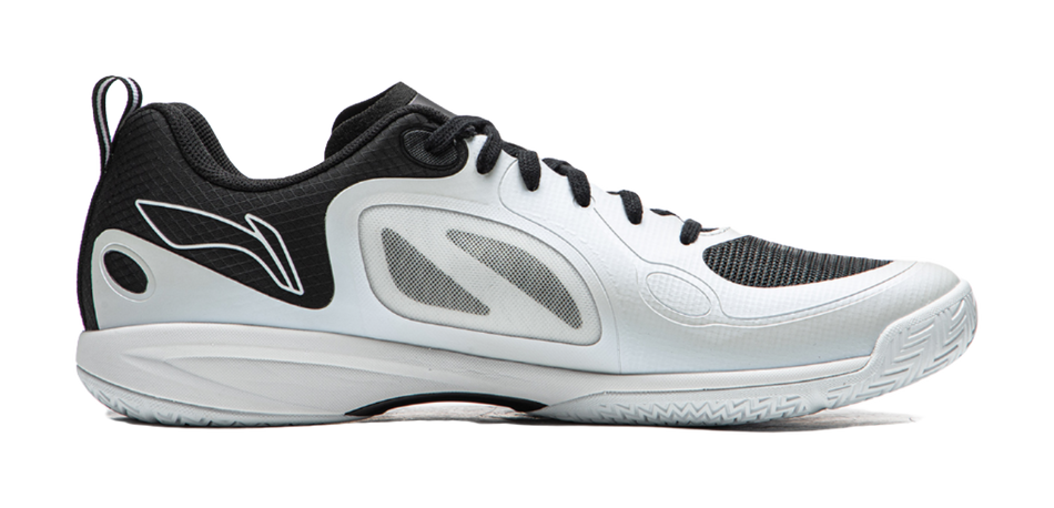 Table tennis shoe in white with black panels, lace-up front, and curved sole