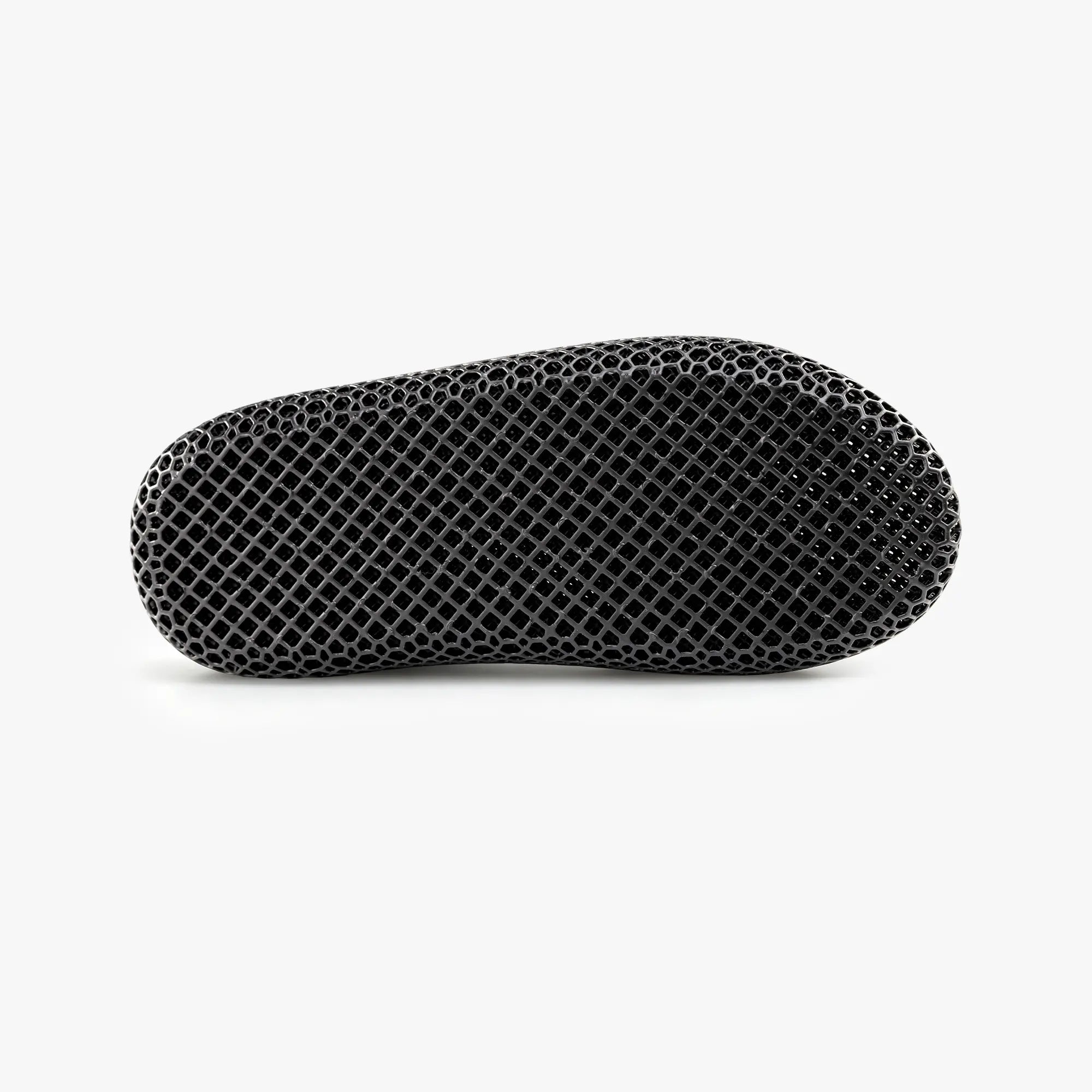 Black 3D-printed slip-on slipper with textured honeycomb upper and rounded toe