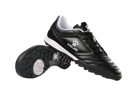 Black TF training soccer shoe with white outsole, lace-up, and paw logo
