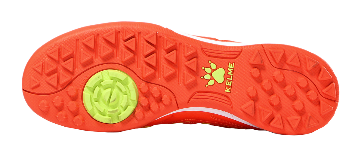 Orange outsole of TF training soccer shoes with tread studs and round KELME emblem