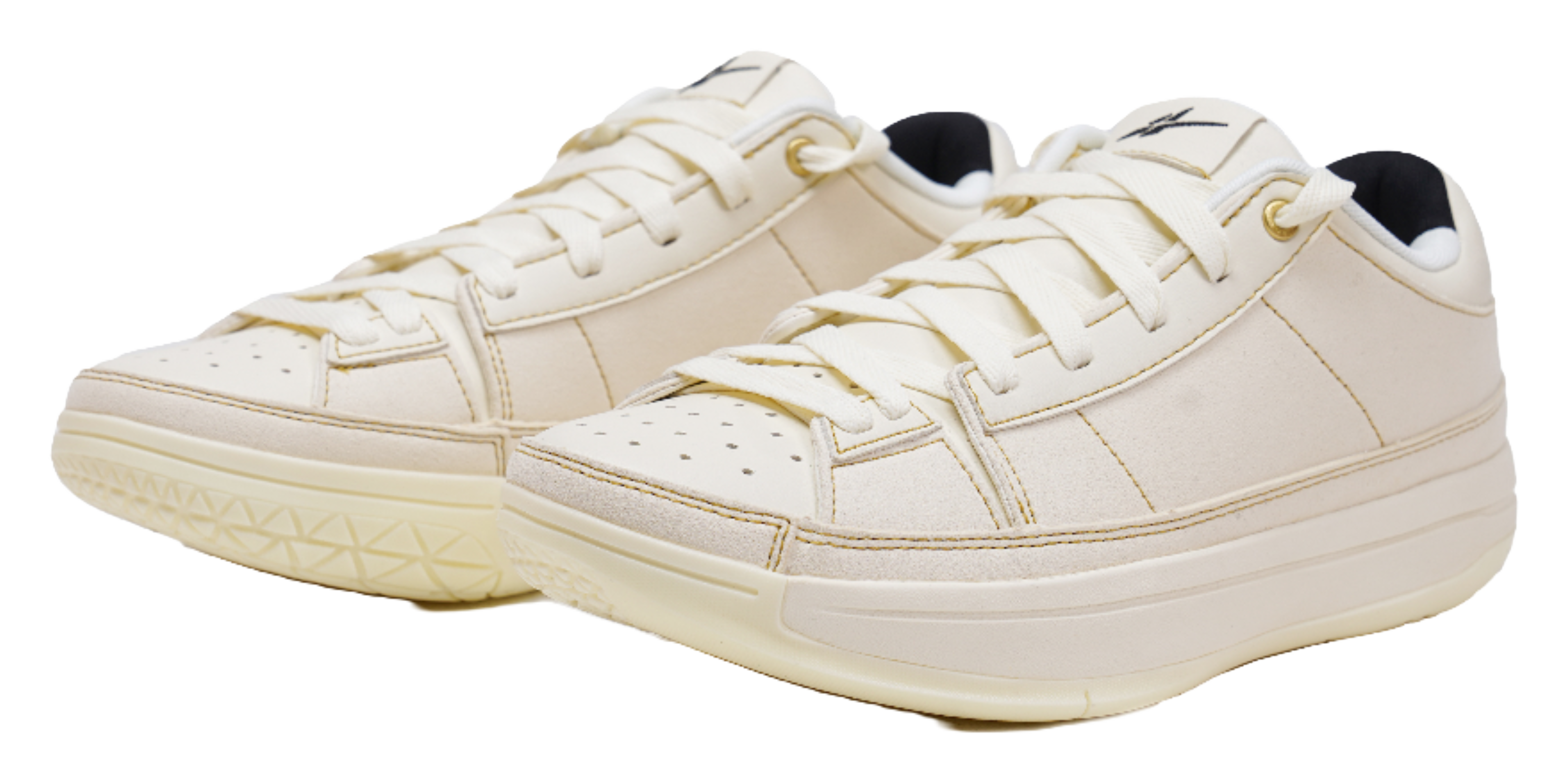 Cream lace-up sneakers with perforated toe panel and cushioned collar