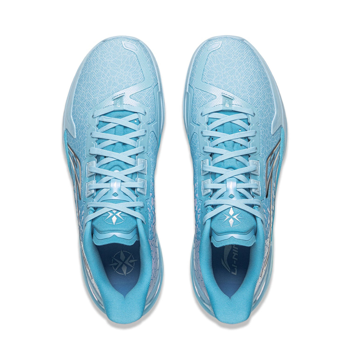 Pair of light blue basketball shoes, lace-up front, patterned collar and tongue