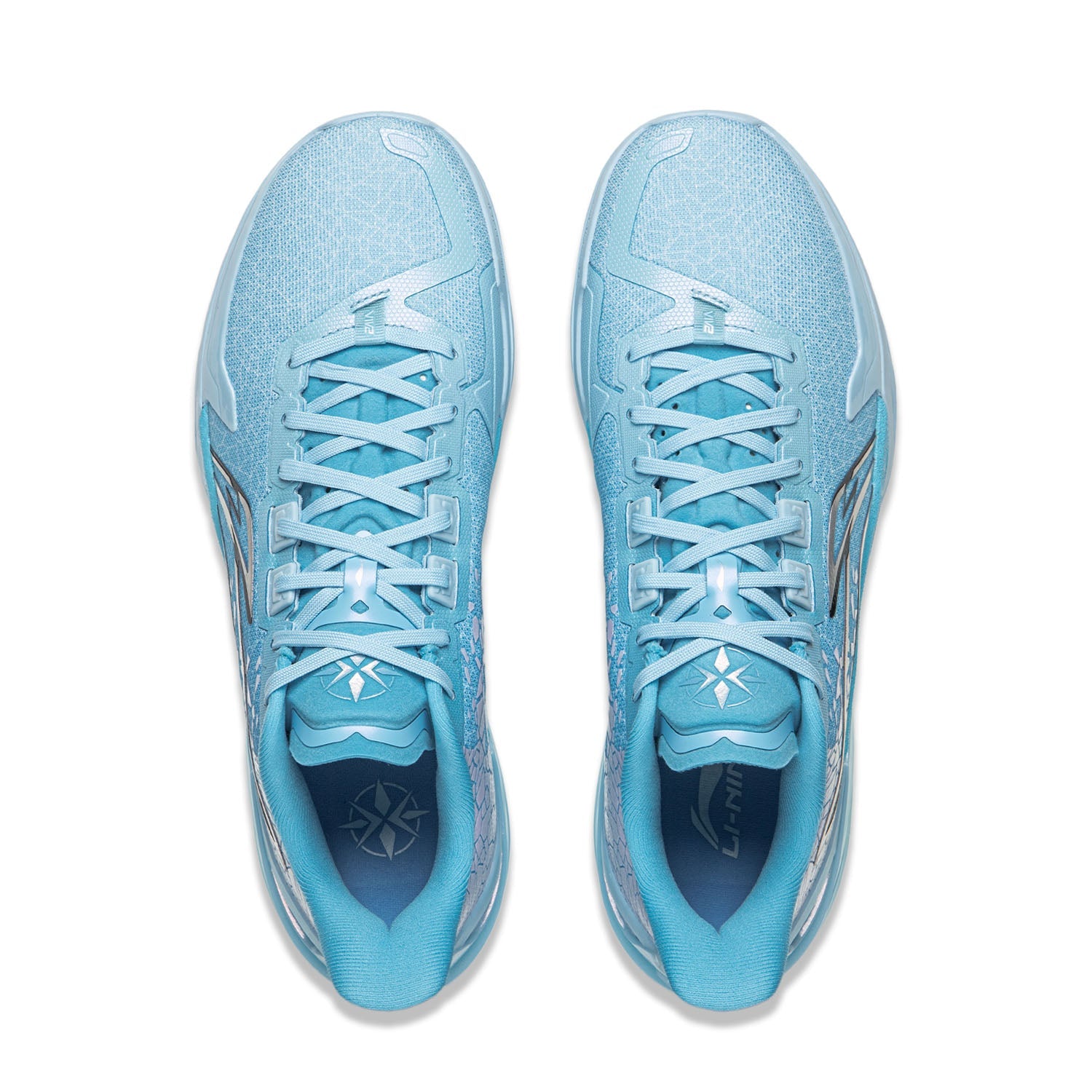 Pair of light blue basketball shoes, lace-up front, patterned collar and tongue