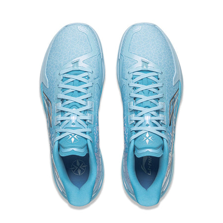 Pair of light blue basketball shoes, lace-up front, patterned collar and tongue