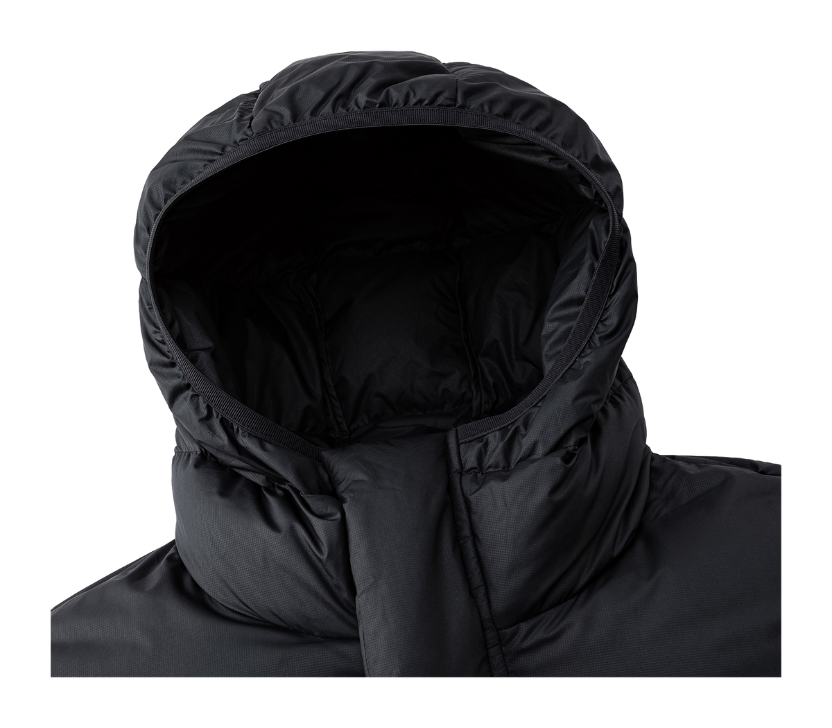 Black hooded puffer jacket hood opening and seam detailing.