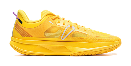 Yellow basketball shoe with textured upper, white stripes, and lace-up front
