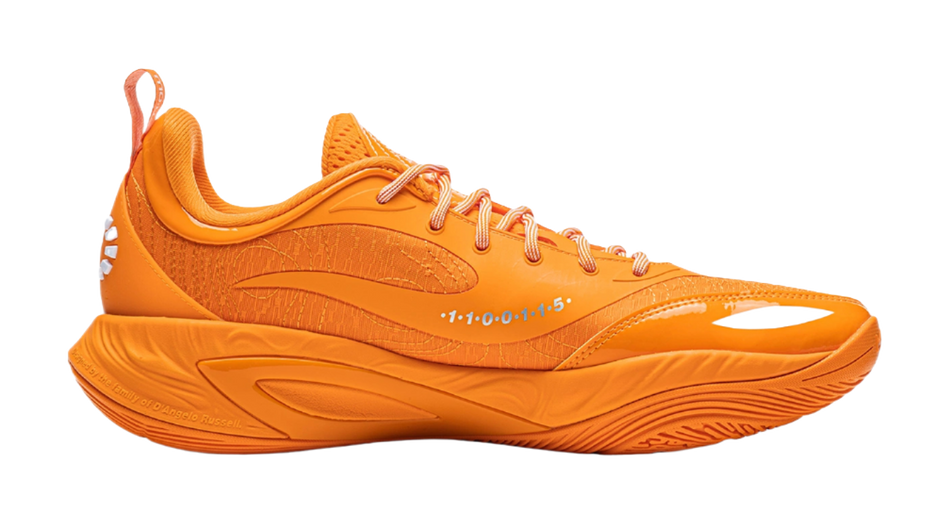 Orange low-top basketball shoes with lace-up closure and padded collar